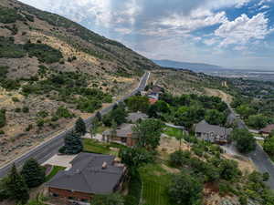 View of property location with a mountain backdrop and nearby suburban area