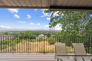 Wooden terrace featuring a mountain view