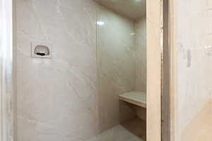 Full bathroom featuring a marble finish shower