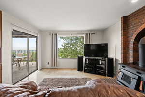Living area featuring light stone finish flooring and baseboards