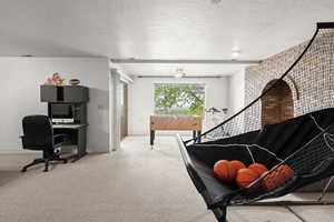 Stairway with carpet and a textured ceiling