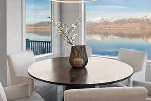 Dining space with a water and mountain view