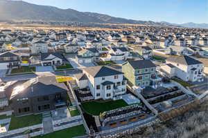 Aerial perspective of suburban area with a mountainous background