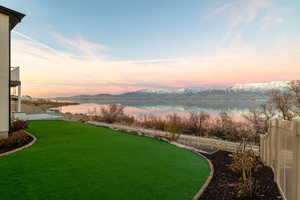 Yard at dusk with a water and mountain view