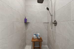 Bathroom view of a tile shower