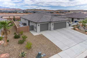 Ranch-style house featuring a gate, a residential view, stucco siding, a garage, and a tiled roof