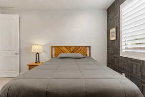 Bedroom featuring multiple windows