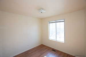 Bedroom 3/Office with baseboards and wood-type flooring