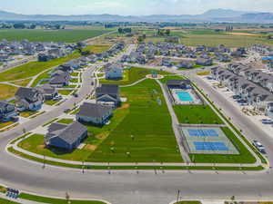 Aerial perspective of suburban area featuring a mountainous background