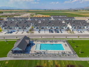 Aerial view of a pool area and a mountainous background