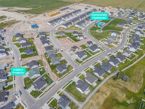 Aerial overview of property's location featuring nearby suburban area