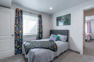 Carpeted bedroom featuring baseboards and recessed lighting