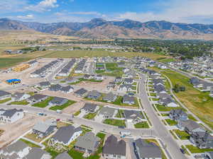 Aerial view of residential area featuring a mountainous background
