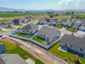 Aerial perspective of suburban area with a mountain backdrop