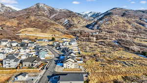 View of mountain backdrop featuring nearby suburban area