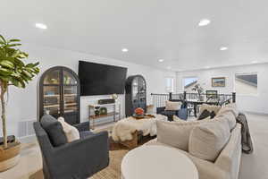 Living area featuring carpet floors and recessed lighting