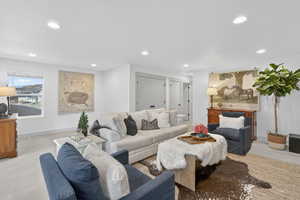Living area featuring recessed lighting and baseboards