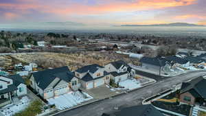 Aerial perspective of suburban area featuring a mountainous background