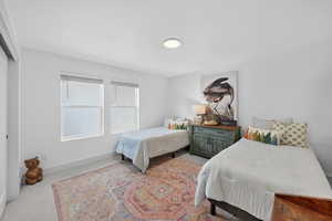Carpeted bedroom with baseboards