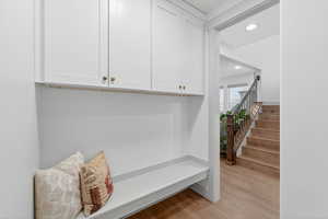 Mudroom featuring light wood-type flooring and recessed lighting