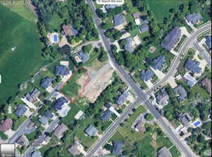 Aerial map of property and surrounding area featuring property boundaries highlighted