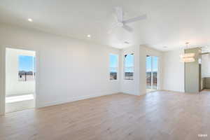Empty room with light wood-type flooring, a ceiling fan, and recessed lighting