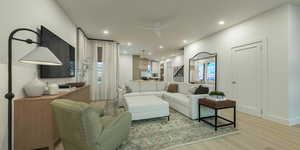 Living room with light wood-style floors, recessed lighting, and a ceiling fan