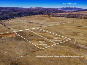 View of rural area featuring a mountain backdrop and a desert landscape