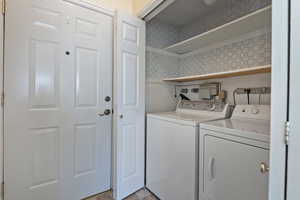 Laundry area with washing machine and clothes dryer