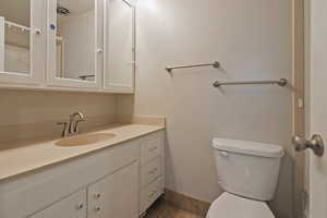 Bathroom featuring vanity and toilet