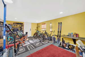 Workout area featuring concrete floors and recessed lighting