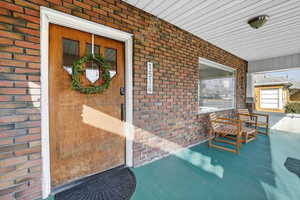 East Facing Front Door and covered porch.