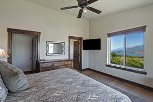 Bedroom with dark wood-style flooring, a ceiling fan, and recessed lighting