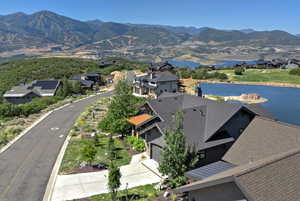 Aerial perspective of suburban area with a water and mountain view