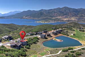 Aerial overview of property's location with a water and mountain view
