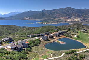 Aerial overview of property's location with a water and mountain view