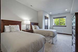 Carpeted bedroom featuring baseboards and recessed lighting
