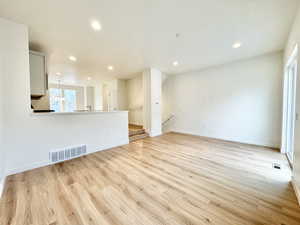Spare room featuring recessed lighting and light wood-style floors