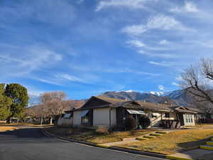 View of front of property featuring a mountain view and a residential view