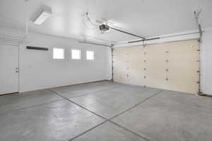 Garage featuring a garage door opener