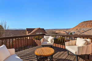 Deck featuring a mountain view and an outdoor lounge area