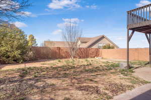 View of fenced backyard