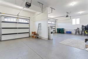 Garage featuring a garage door opener