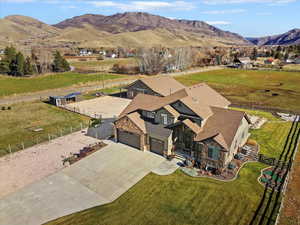 View from above of property with a mountain backdrop