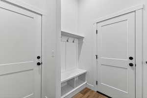 Mudroom featuring light wood finished floors