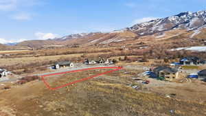 Aerial view of residential area featuring mountains