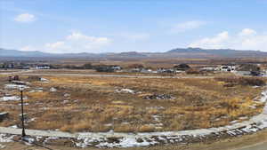 View of mountain background featuring nearby suburban area