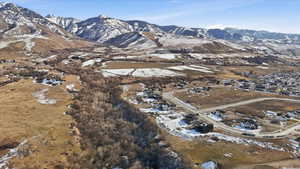 Snowy aerial view featuring a mountain view