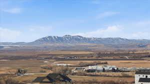 View of mountain background featuring rural landscape