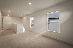 Unfurnished room with carpet floors and recessed lighting